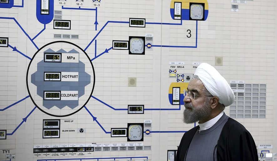 FILE - In this Jan. 13, 2015 file photo, released by the Iranian President&#x27;s Office, President Hassan Rouhani visits the Bushehr nuclear power plant just outside of Bushehr, Iran. On Monday, June 17, 2019, Iran said it will break the uranium stockpile limit set by Tehran&#x27;s nuclear deal with world powers in the next 10 days. (AP Photo/Iranian Presidency Office, Mohammad Berno, File)