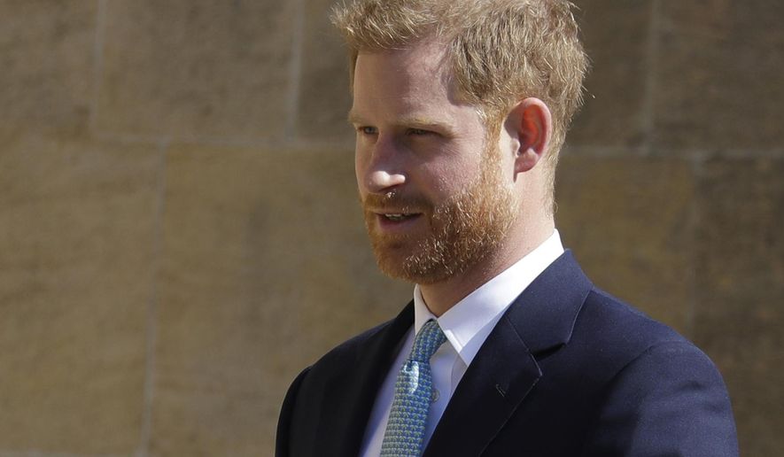 FILE - In this Sunday, April 21, 2019 file photo, Britain's Prince Harry arrives to attend the Easter Mattins Service at St. George's Chapel, at Windsor Castle in England. Prince Harry is offering his support to Angola’s new 47 million pound ($60 million) initiative to clear land-mines, saying it will protect lives and help communities through conservation-led development. Speaking Monday at the Chatham House think tank, Harry picked up the mantle for a cause near to the heart of his mother, the late Princess Diana, who worked with the Halo Trust on de-mining issues. (AP Photo/Kirsty Wigglesworth, file)