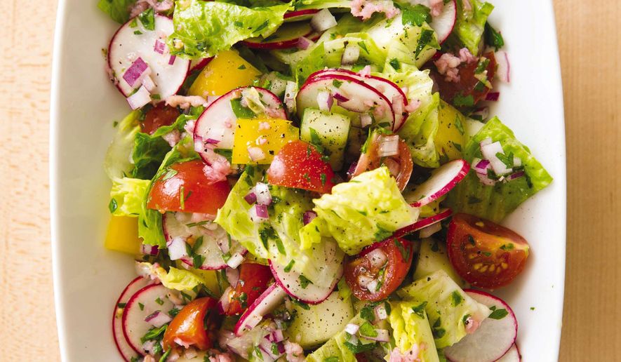 This undated photo provided by America's Test Kitchen in June 2019 shows a Summer Vegetable Chopped Salad in Brookline, Mass. This recipe appears in the cookbook "New Essentials." (Joe Keller/America's Test Kitchen via AP)