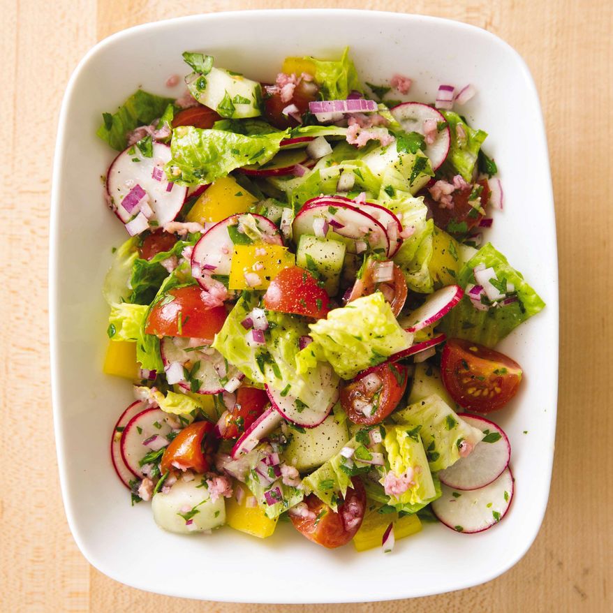 This undated photo provided by America's Test Kitchen in June 2019 shows a Summer Vegetable Chopped Salad in Brookline, Mass. This recipe appears in the cookbook "New Essentials." (Joe Keller/America's Test Kitchen via AP)