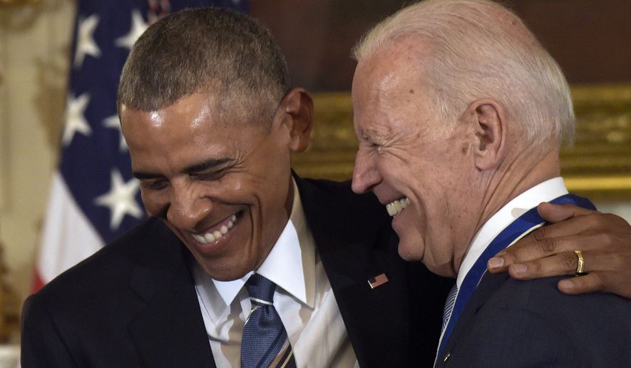 President Barack Obama laughs with Vice President Joe Biden during a ceremony in the State Dining Room of the White House in Washington, Thursday, Jan. 12, 2017. Obama presented Biden with the Presidential Medal of Freedom. (AP Photo/Susan Walsh) ** FILE **