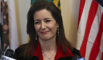 Oakland Mayor Libby Schaaf smiles during a media conference on Wednesday, March 7, 2018, in Oakland, Calif. (AP Photo/Ben Margot)