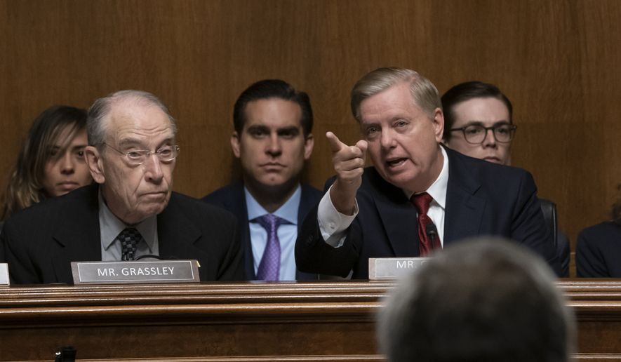 Senate Judiciary Committee Chairman Sen. Lindsey Graham, R-S.C., joined at left by Sen. Chuck Grassley, R-Iowa, left, gives an opening statement before swearing-in Attorney General William Barr to testify, on Capitol Hill in Washington, Wednesday, May 1, 2019. (AP Photo/J. Scott Applewhite) ** FILE **
