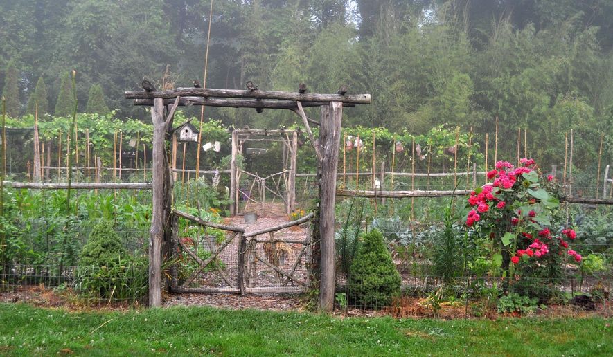 This undated photo shows the entrance to a garden in New Paltz, N.Y. For the Garden Conservancy's "Open Days" program, a number of private gardens across the country open their gates for visitors. (Lee Reich via AP)