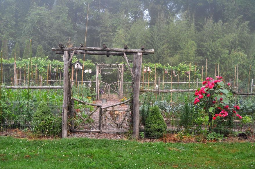 This undated photo shows the entrance to a garden in New Paltz, N.Y. For the Garden Conservancy's "Open Days" program, a number of private gardens across the country open their gates for visitors. (Lee Reich via AP)