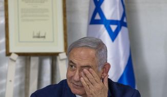 Israeli Prime Minister Benjamin Netanyahu convenes his Cabinet to inaugurate a new settlement named after President Donald Trump in a gesture of appreciation for the U.S. leader&#39;s recognition of Israeli sovereignty over the Golan Heights, Sunday, June 16, 2019. The Trump name graces apartment towers, hotels and golf courses. Now it is the namesake of a tiny Jewish settlement in the Israeli-controlled Golan Heights. (AP Photo/Ariel Schalit)