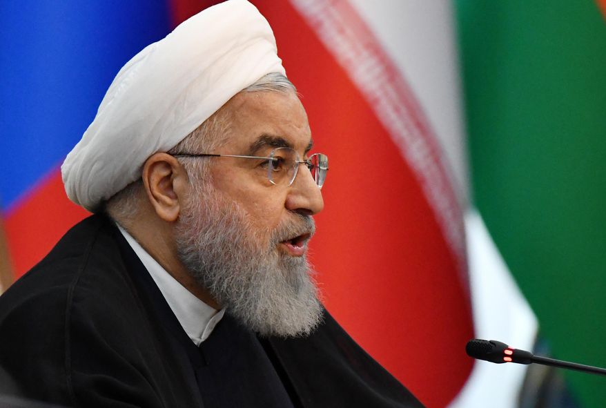 Iranian President Hassan Rouhani speaks during a session of the Shanghai Cooperation Organization summit in Bishkek, Kyrgyzstan, Friday, June 14, 2019. The Shanghai Cooperation Organization is a security alliance that brings together Russia, China, India, Pakistan along with ex-Soviet Central Asia nations of Kazakhstan, Kyrgyzstan, Tajikistan and Uzbekistan. (AP Photo/Vladimir Voronin)