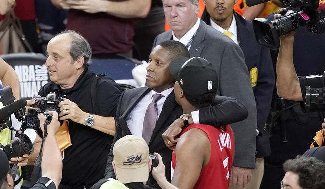 FILE - This Thursday, June 13, 2019, file photo, Toronto Raptors general manager Masai Ujiri, center left, walks with guard Kyle Lowry after the Raptors defeated the Golden State Warriors in Game 6 of the NBA Finals in Oakland, Calif. An attorney for a deputy involved in an altercation with Ujiri as he tried to join his team on the court to celebrate their NBA championship, said his client suffered a concussion and is on medical leave. Attorney David Mastagni said Tuesday, June 18, 2019, the 20-year-veteran of the Alameda County Sheriff&#x27;s Office has a jaw injury and is considering filing a lawsuit. (AP Photo/Tony Avelar, File)