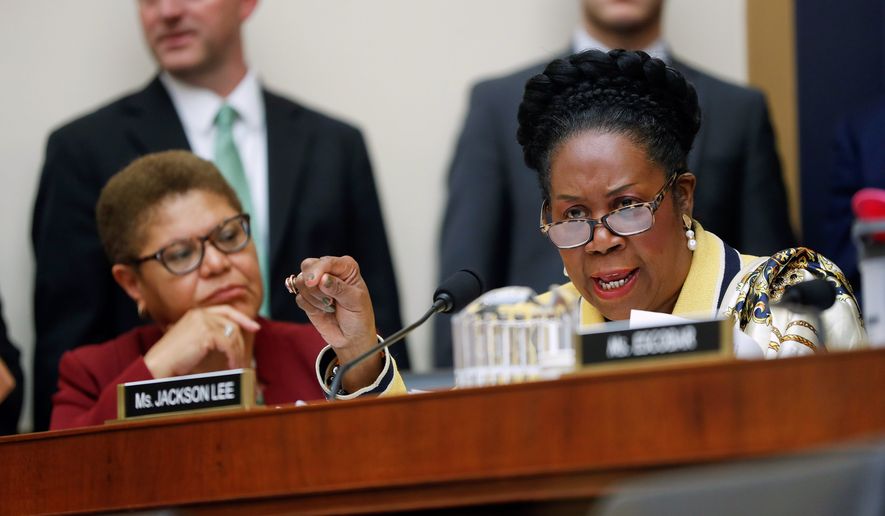 "Slavery is the original sin. Slavery has never received an apology," said Rep. Sheila Jackson Lee, Texas Democrat (right). She is sponsoring House Resolution 40, the reparations-study legislation. (Associated Press photographs)