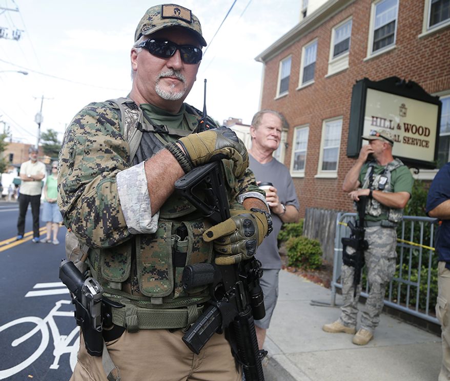 31. Michigan, gun ownership rate: 28.8 percent
30. Virginia, gun ownership rate: 29.3 percent
An armed militia member stands guard at a white nationalist rally in Charlottesville, Va. Virginia Democrats, who made big gains in the swing state on Election Day, say their newfound clout has increased the odds of passing gun control measures in the coming year. (AP Photo/Steve Helber, File)