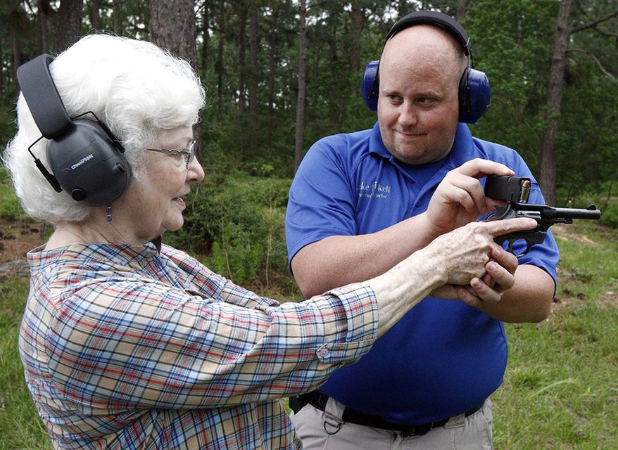 13. Mississippi, gun ownership rate: 42.8 percent
12. South Carolina, gun ownership rate: 44.4 percent
Jake Driskell, a Laurel police officer and owner of Gun Guy Tactical, helps Crestview Baptist Church member and first time shooter Katherine Huffman, line up her sights with her husband's revolver during the live fire portion of a enhanced concealed carry class sponsored by the church for members and area residents in Petal, Miss. The 20 participants received hands on assistance during a practical shooting exercise, a thorough review on the fundamentals of safe handling of firearms in addition to a review of the basic and enhanced Mississippi Concealed Carry laws. (AP Photo/Rogelio V. Solis)