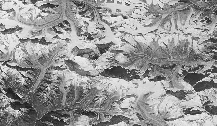 This Jan. 3 1976 photo made by the National Reconnaissance Office shows Mount Everest at center. This and other once-classified Cold War era spy satellite images are showing scientists that glaciers on the Himalayas are now melting about twice as fast as they used to. (National Reconnaissance Office via AP)