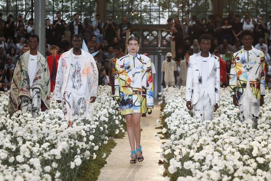 Model Gigi Hadid, centre, wears a creation for the Off White mens Spring-Summer 2020 fashion collection presented in Paris, Wednesday, June 19. (AP Photo/Thibault Camus)