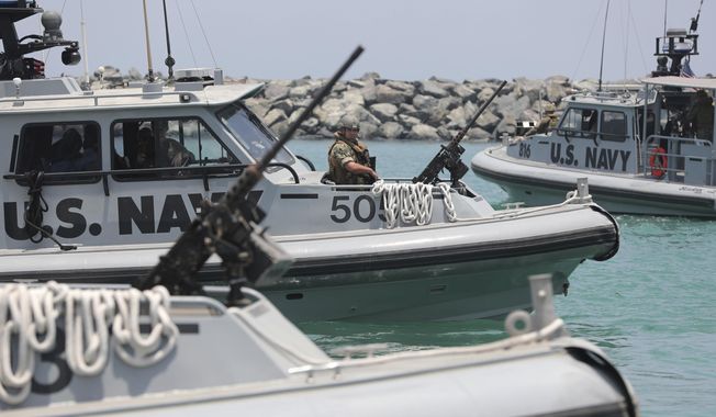 U.S. Navy patrol boats carrying journalists to see damaged oil tankers leave a U.S. Navy 5th Fleet base near Fujairah, United Arab Emirates, Wednesday, June 19, 2019. (AP Photo/Kamran Jebreili) ** FILE **