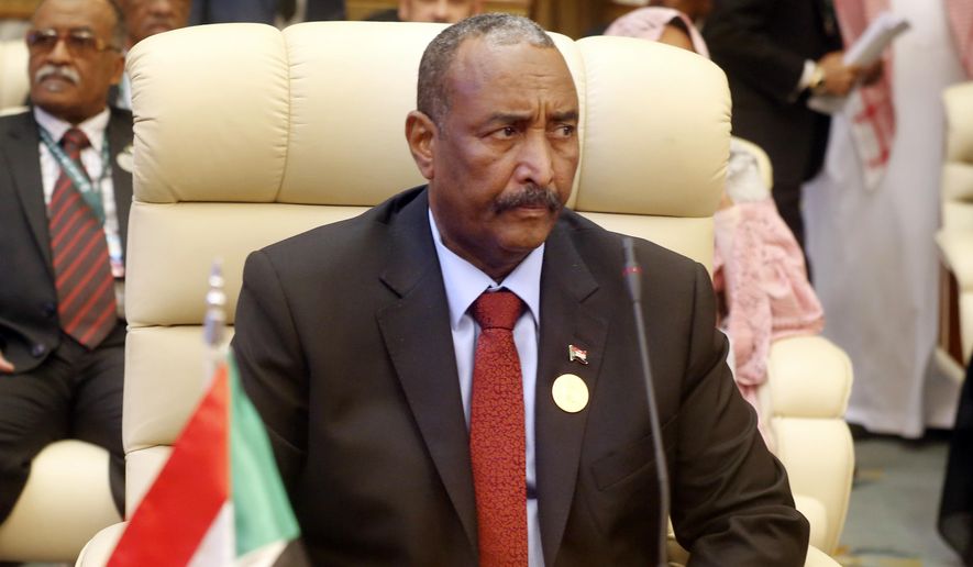 FILE - In this May 30, 2019 file photo, Abdel-Fattah Burhan, the head of Sudan's ruling military council, attends an emergency summit of Gulf Arab leaders in Mecca, Saudi Arabia. Sudan’s military council is urging protest leaders to resume negotiations on the transition of power, but says talks “should not be preconditioned.” Gen. Abdel-Fattah Burhan, head of the council, said Wednesday, June 19, 2019, that the council has no preconditions for returning to the negotiating table with the Forces for Declaration of Freedom and Change, which has represented protesters. (AP Photo/Amr Nabil, File)