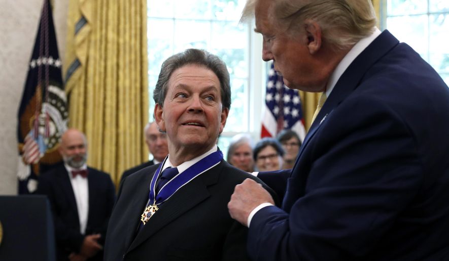 President Donald Trump awards the Presidential Medal of Freedom to economist Arthur Laffer, Wednesday June 19, 2019, in the Oval Office of the White House in Washington. (AP Photo/Jacquelyn Martin)