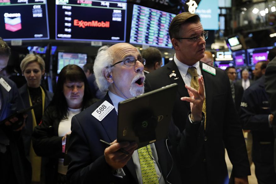 Trader Peter Tuchman works on the floor of the New York Stock Exchange, Thursday, June 20, 2019. Stocks are opening broadly higher on Wall Street, erasing the market's losses from May and setting the S&P 500 on course to reach another record high. (AP Photo/Richard Drew)