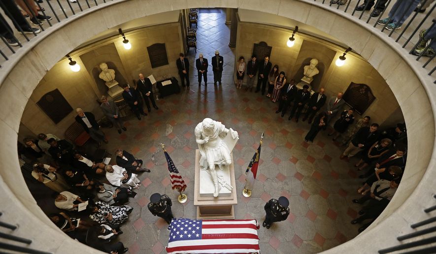 U.S. Army Pfc. William Hoover Jones lies in honor at the North Carolina State Capitol in Raleigh, N.C., Friday, June 21, 2019. Pfc. Jones was a member of Company E, 2nd Battalion, 24th Infantry Regiment, 25th Infantry Division during the Korean War. He was reported missing in action in North Korea on Nov. 26, 1950. Last year, North Korea turned over 55 boxes containing remains of U.S. service members killed during the Korean War, Jones' remains were among those. (AP Photo/Gerry Broome)
