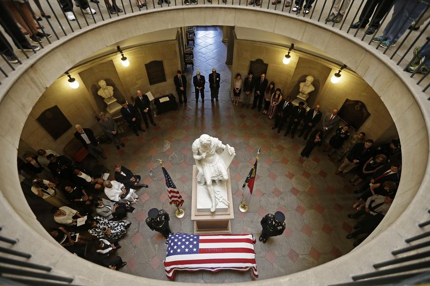 U.S. Army Pfc. William Hoover Jones lies in honor at the North Carolina State Capitol in Raleigh, N.C., Friday, June 21, 2019. Pfc. Jones was a member of Company E, 2nd Battalion, 24th Infantry Regiment, 25th Infantry Division during the Korean War. He was reported missing in action in North Korea on Nov. 26, 1950. Last year, North Korea turned over 55 boxes containing remains of U.S. service members killed during the Korean War, Jones' remains were among those. (AP Photo/Gerry Broome)