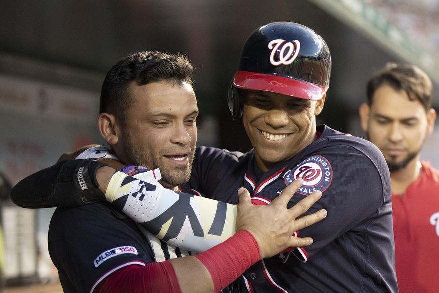 Washington Nationals, Juan Soto, front right, celebrates with teammate Gerardo Parra after scoring during the fifth inning of a baseball game against the Atlanta Braves in Washington, Friday, June 21, 2019. (AP Photo/Manuel Balce Ceneta)