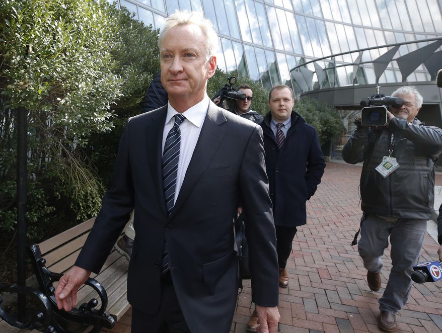 FILE-- In this April 2, 2019 file photograph, Toby MacFarlane departs federal court in Boston. MacFarlane, a former insurance executive, pleaded guilty Friday, June 21 in Boston federal court to a charge of conspiracy to commit mail fraud and honest services mail fraud. Authorities say MacFarlane paid $450,000 to get his children admitted to the University of Southern California as fake athletic recruits. (AP Photos/Michael Dwyer, file)