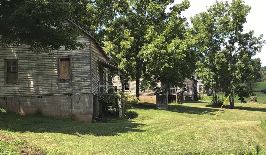This undated photo made available by Calvin Reyes, shows buildings in an abandoned mill village near Asheville, NC., that was used in the first "Hunger Games" movie. The village is now a historic site. The designation for the Henry River Mill Village was announced earlier this week. (Calvin Reyes via AP)