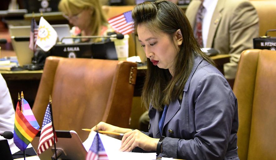 Assemblywoman Yuh-Line Niou, D-New York, works on legislation in the Assembly Chamber at the state Capitol Thursday, June 20, 2019, in Albany, N.Y. (AP Photo/Hans Pennink)