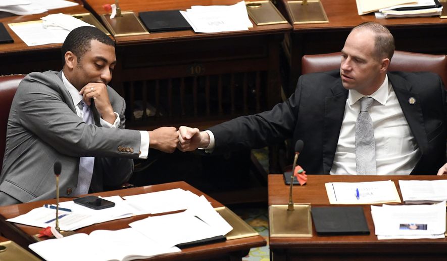New York Sen. Jamaal T. Bailey, D-Bronx, left, fist bumps Sen. Timothy M. Kennedy, D-Buffalo, after Bailey&#x27;s legislation expanding decriminalization legislation for marijuana passed during a legislative session the Senate Chamber at the state Capitol Thursday, June 20, 2019, in Albany, N.Y. (AP Photo/Hans Pennink)