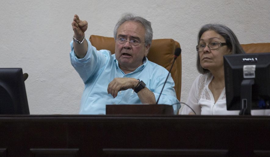 FILE - In this May 6, 2018 file photo, Congress President Gustavo Porras, left, begins a session to elect five members for a special commission to investigate the events during last month's deadly protests, at Congress in Managua, Nicaragua. The Trump administration imposed sanctions Friday, June 21, 2019, on four Nicaraguan officials accused of being responsible for a crackdown on street demonstrations that began in the Central American country in April 2018. The officials are National Assembly President Gustavo Porras; telecommunications institute director Orlando José Castillo; Health Minister Sonia Castro; and Transportation Minister Oscar Mojica. (AP Photo/Moises Castillo, File)