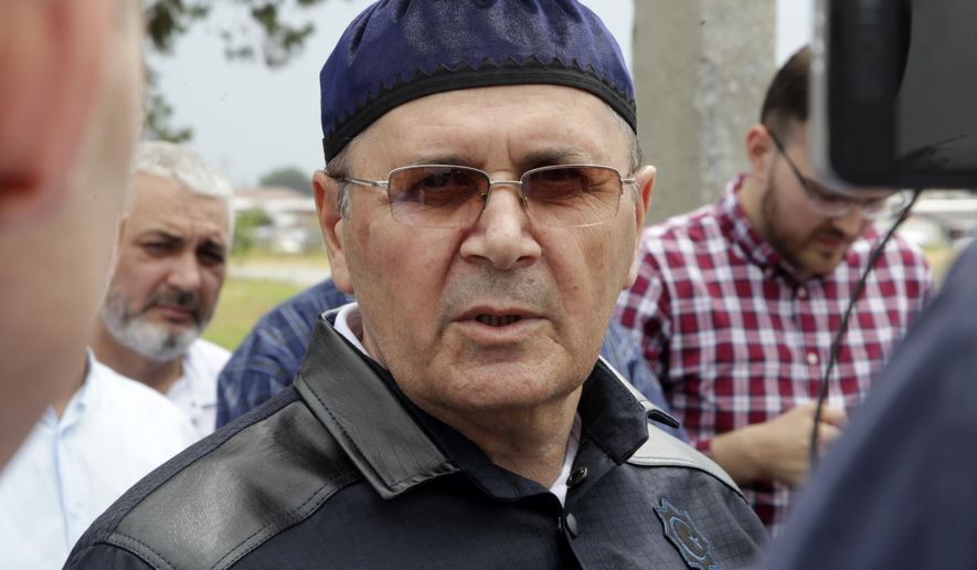 Oyub Titiev, the head of a Chechnya branch of the prominent human rights group Memorial speaks to his supporters as he leaves a prison in Argun, Russia, Friday, June 21, 2019. Titiyev was released from a Russian prison on Friday morning, more than 18 months after first being detained on drug charges his supporters say were fabricated. (AP Photo/Musa Sadulayev)