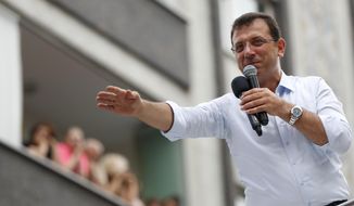 In this Wednesday, June 19, 2019 photo, Ekrem Imamoglu, candidate of the secular opposition Republican People&#39;s Party, or CHP, waves to supporters as he speaks at a rally in Istanbul, ahead of the June 23 re-run of Istanbul elections. Voters in Istanbul return to the polls on Sunday for a rerun of the election for the mayor of the city. (AP Photo/Lefteris Pitarakis)