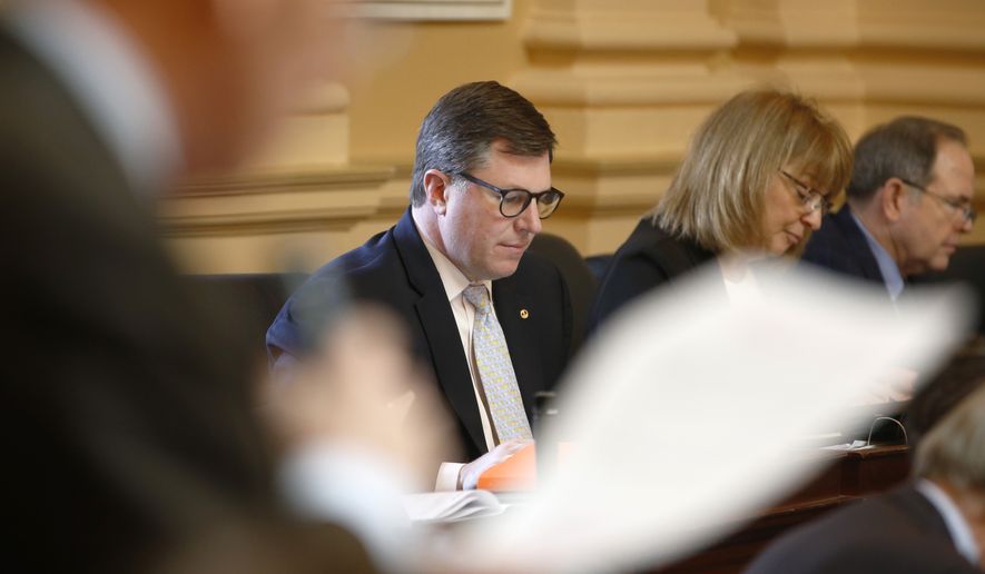 Virginia Del. Chris Peace, R-Hanover, listens to debate on the floor of the House during the session at the Capitol in Richmond, Va., Friday, Feb. 15, 2019. (AP Photo/Steve Helber)