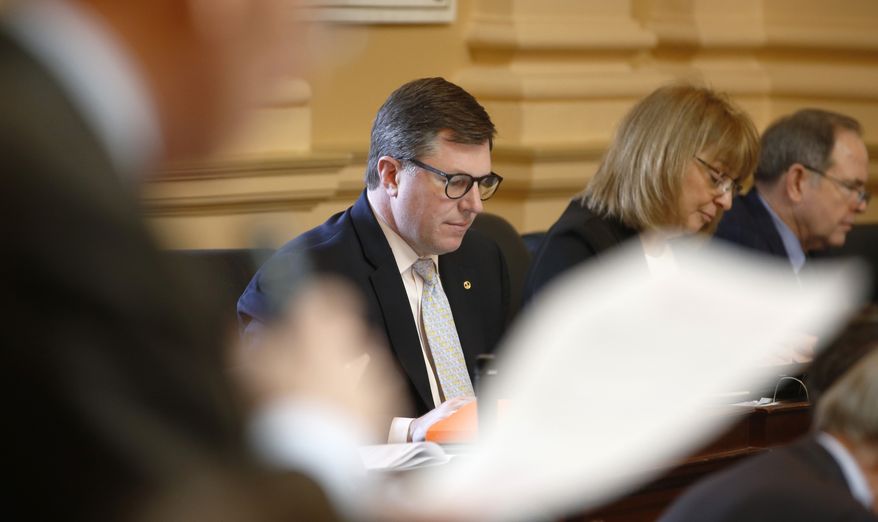 Virginia Del. Chris Peace, R-Hanover, listens to debate on the floor of the House during the session at the Capitol in Richmond, Va., Friday, Feb. 15, 2019. (AP Photo/Steve Helber)