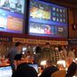 In this March 21, 2019, file photo, gamblers line up to place bets on the NCAA men&#39;s college basketball tournament at the Borgata casino in Atlantic City N.J. This is the first March Madness tournament since legal gambling expanded last year in the U.S.  The spread of legalized sports betting is largely following regional boundaries. Lawmakers across the Northeast and upper Midwest have generally approved it or are still considering doing so this year. But in the Deep South and far West, fewer states are rushing in a year after the US Supreme Court cleared the way for legal sports betting nationally. (AP Photo/Wayne Parry, File) **FILE**
