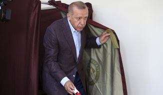 Turkey&#39;s President Recep Tayyip Erdogan casts his ballot at a polling station in Istanbul, Sunday, June 23, 2019. Polls have opened in a repeat election in Turkey&#39;s largest city where Erdogan and his political allies could lose control of Istanbul&#39;s administration for the first time in 25 years. (AP Photo/Emrah Gurel)