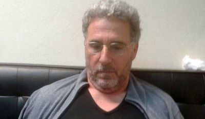 In this photo taken on Sunday, Sept. 3, 2017, a man identified by Italian Police as longtime fugitive Rocco Morabito looks down after being arrested in a Montevideo hotel, Uruguay. Italian authorities say a top &#39;ndrangheta crime syndicate boss, on the run since 1994, has been arrested in Uruguay where he had been living under a false name and with a forged Brazilian passport. Reggio Calabria Chief Prosecutor Federico Cafiero de Raho said Monday longtime fugitive Rocco Morabito played a big role in cocaine trafficking between South America and Milan, a distribution point for the drug to be sold elsewhere. The Calabria-based &#39;ndrangheta is one of the world&#39;s biggest cocaine traffickers. (Italian Police via AP)