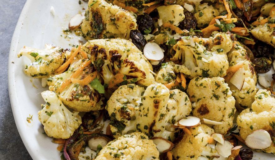 This undated photo provided by America's Test Kitchen in June 2019 shows Cauliflower Salad with Chermoula and Carrots in Brookline, Mass. This recipe appears in the cookbook “Vegan for Everybody.” (Daniel J. van Ackere/America's Test Kitchen via AP)