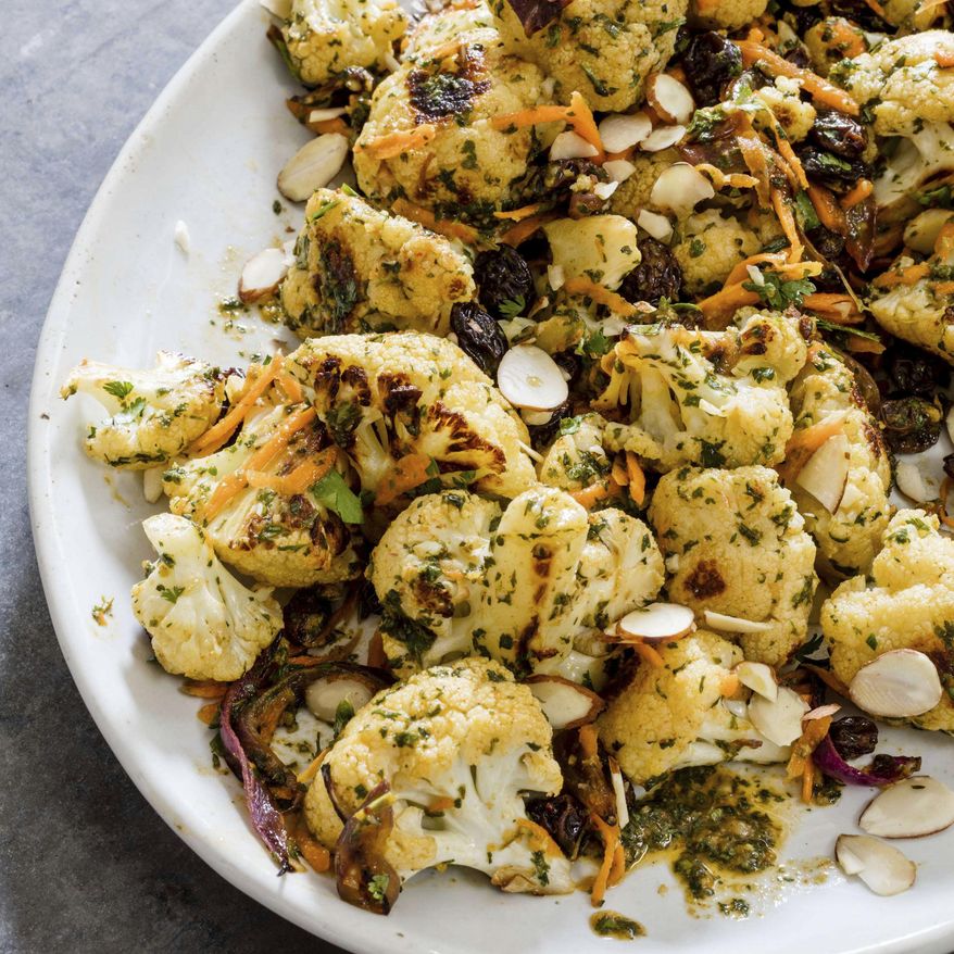 This undated photo provided by America's Test Kitchen in June 2019 shows Cauliflower Salad with Chermoula and Carrots in Brookline, Mass. This recipe appears in the cookbook “Vegan for Everybody.” (Daniel J. van Ackere/America's Test Kitchen via AP)
