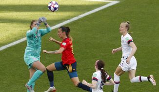 United States goalkeeper Alyssa Naeher, left, makes a save in front of Spain&#39;s Virginia Torrecilla, second left, during the Women&#39;s World Cup round of 16 soccer match between Spain and United States at Stade Auguste-Delaune in Reims, France, Monday, June 24, 2019. (AP Photo/Thibault Camus)