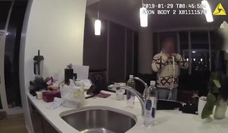 This Jan. 29, 2019, image made from police body cam video provided by the Chicago Police Department purports to show Jussie Smollett, with a white rope wrapped around his neck, talking with police officers in his apartment in Chicago. Chicago police on Monday, June 24, released hundreds of files from the investigation into Smollett&#x27;s claim he was attacked by two men, including releasing the video footage for the first time of the &amp;quot;Empire&amp;quot; actor wearing the thin white rope wrapped around his neck that he told detectives was a noose. The footage from the Chicago police blurred out Smollett&#x27;s face because, police explained, he was considered a victim at that point. (Chicago Police Department via AP)