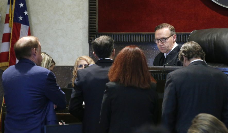 Judge Thad Balkman speaks with attorneys during the opioid trial Monday, June 24, 2019 in Norman, Okla. (AP Photo/Sue Ogrocki, Pool)