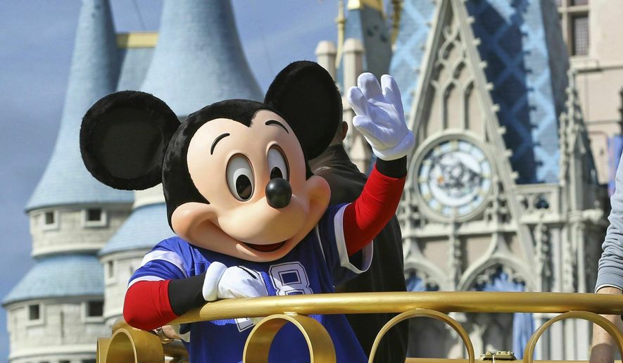 FILE - In this Feb. 4, 2019, file photo, Mickey Mouse celebrates the Super Bowl winning team, the New England Patriots, during the Super Bowl victory parade in the Magic Kingdom at Walt Disney World in Lake Buena Vista, Fla. Months after workers who play Mickey Mouse and Goofy at Walt Disney World threatened to leave the Teamsters union because of what they called &amp;quot;horrible misrepresentation,&amp;quot; General President James Hoffa has appointed two associates to take over the local union in Orlando, Fla., according to a letter from Hoffa posted Monday, June 24, to the doors of the Local 385 union hall. (Joe Burbank/Orlando Sentinel via AP, File)