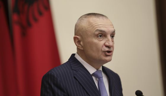 FILE - In this June 10, 2019 file photo, Albanian President Ilir Meta speaks during a news conference in Tirana, Albania. Meta condemned a decision by electoral authorities in favor of holding municipal elections this weekend, saying on Tuesday, June 25, 2019, that the ruling Socialists should hold talks and not carry out an “imaginary” voting process.  (AP Photo/Hektor Pustina, File)