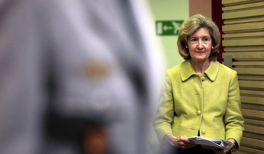 United States Ambassador to NATO Kay Bailey Hutchison walks to the podium prior to a media conference at NATO headquarters in Brussels, Tuesday, June 25, 2019. (AP Photo/Virginia Mayo)