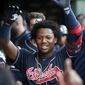 Atlanta Braves&#39; Ronald Acuna Jr. celebrates his home run off Chicago Cubs starting pitcher Adbert Alzolay during the first inning of a baseball game, Tuesday, June 25, 2019, in Chicago. (AP Photo/Charles Rex Arbogast)