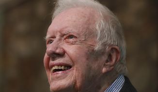 In this June 9, 2019 file photo, former President Jimmy Carter smiles as he returns to Maranatha Baptist Church to teach Sunday School, less than a month after falling and breaking his hip, in Plains Ga.  (Curtis Compton/Atlanta Journal-Constitution via AP, File) **FILE**