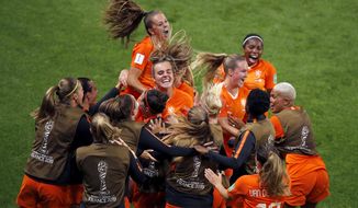 Netherlands&#39; Lieke Martens, top, celebrates with teammates after scoring her team&#39;s second goal from the penalty spot during the Women&#39;s World Cup round of 16 soccer match between the Netherlands and Japan at Roazhon Park, in Rennes, France, Tuesday, June 25, 2019. (AP Photo/Francois Mori)