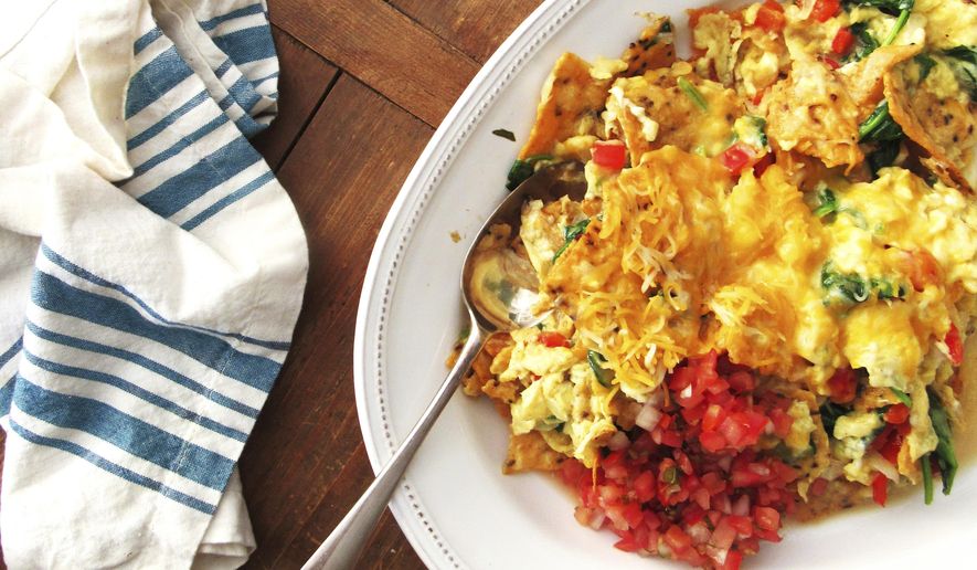 This August 2016 photo shows Migas, a madcap scrambled egg dish in New York. (Laura Agra/Katie Workman via AP)