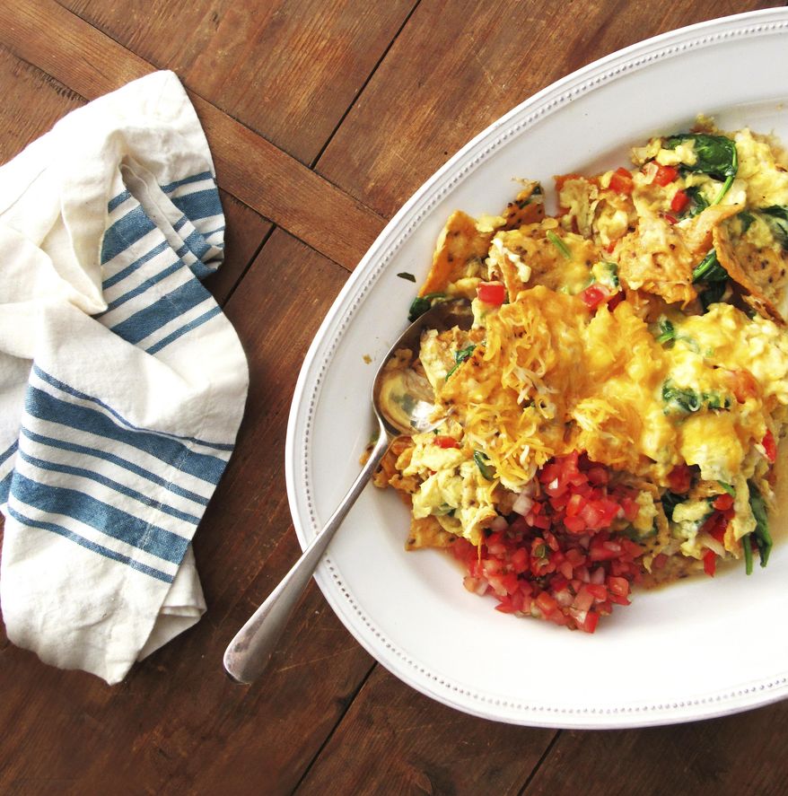 This August 2016 photo shows Migas, a madcap scrambled egg dish in New York. (Laura Agra/Katie Workman via AP)