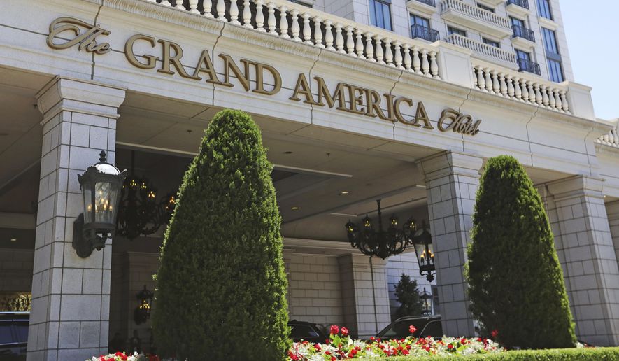 This Sunday, June 23, 2019, photo, shows the Grand America Hotel in Salt Lake City. A lawsuit filed Tuesday, accuses the luxury Grand America Hotel in Salt Lake City of luring workers from the Philippines to a program that promised training and cultural immersion but instead forced them to work long hours doing menial jobs for low pay. (AP Photo/Rick Bowmer)